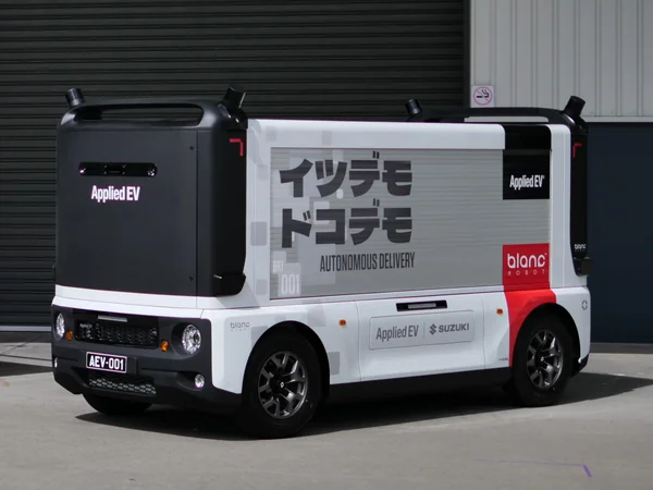Applied EV Blanc Robot outside a workshop