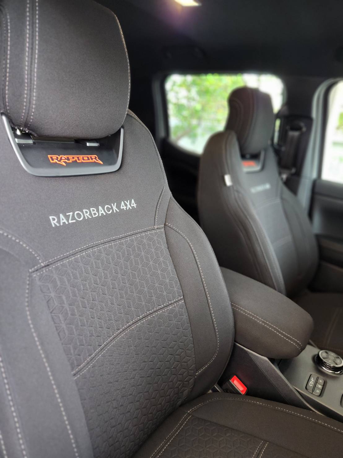 Razorback 4x4 canvas seat covers with embroidered lettering fitted in a Ford Ranger Raptor cabin